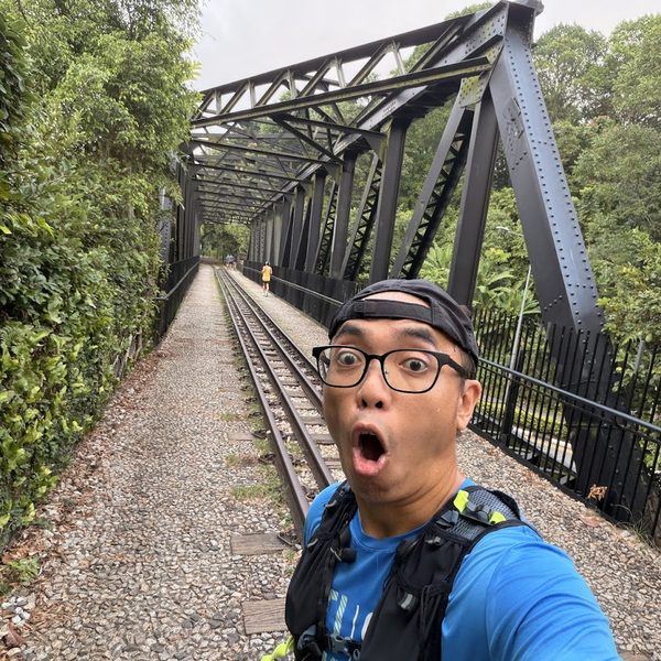 Kao running along a railway track in Singapore
